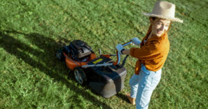 woman mowing
